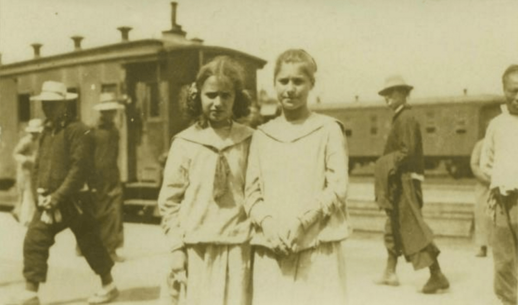 Slobodkina and her sister Tamara at the train station in Harbin en route to Vladivostok, May 1919.