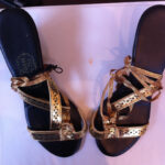 Gold sandals with jeweled clasp