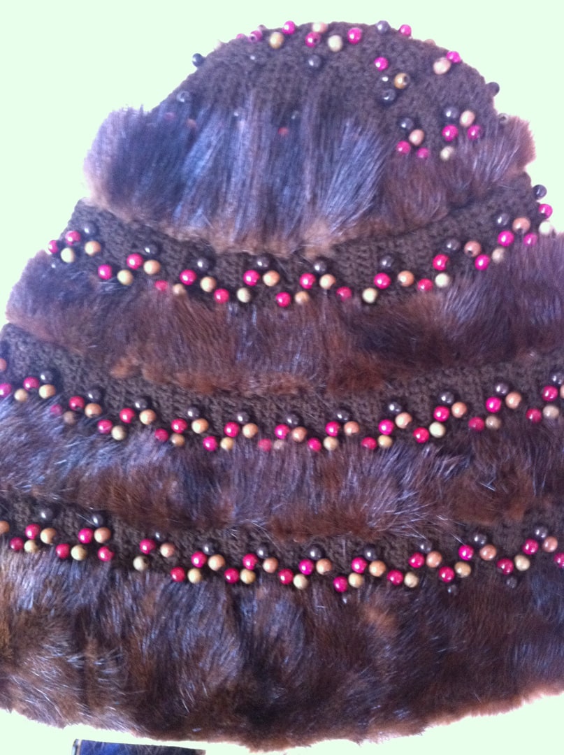 Fur hat trimmed with crocheted ribbon and recycled beads