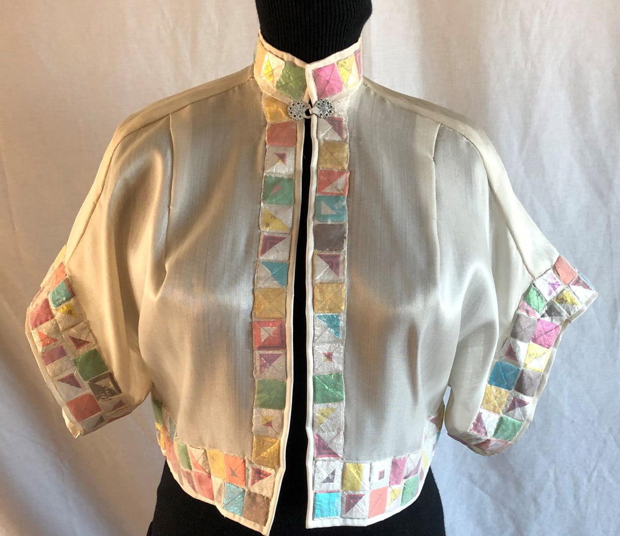 Light colored Bolero jacket with Brach candy wrapper trim