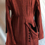 Dress, terra cotta and black pin-checkered material trimmed with black velvet and jet buttons