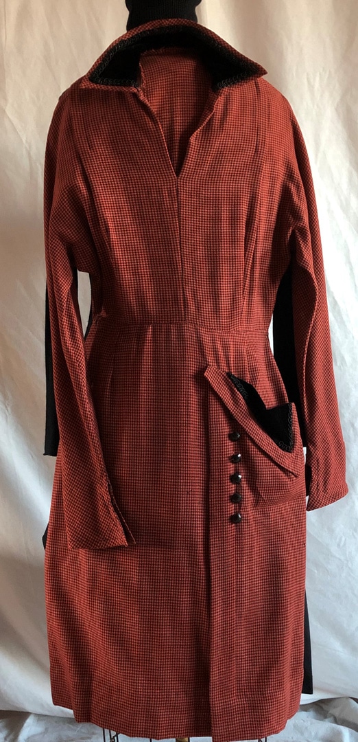 Dress, terra cotta and black pin-checkered material trimmed with black velvet and jet buttons